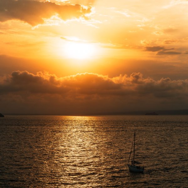 Cinematic sunset photo in Marseille, France. Boat sailing, colorful sky, landscape, reborn, hopeful